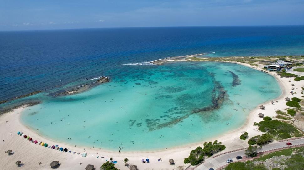 Turquoise lagoon and tropical beach seen from above